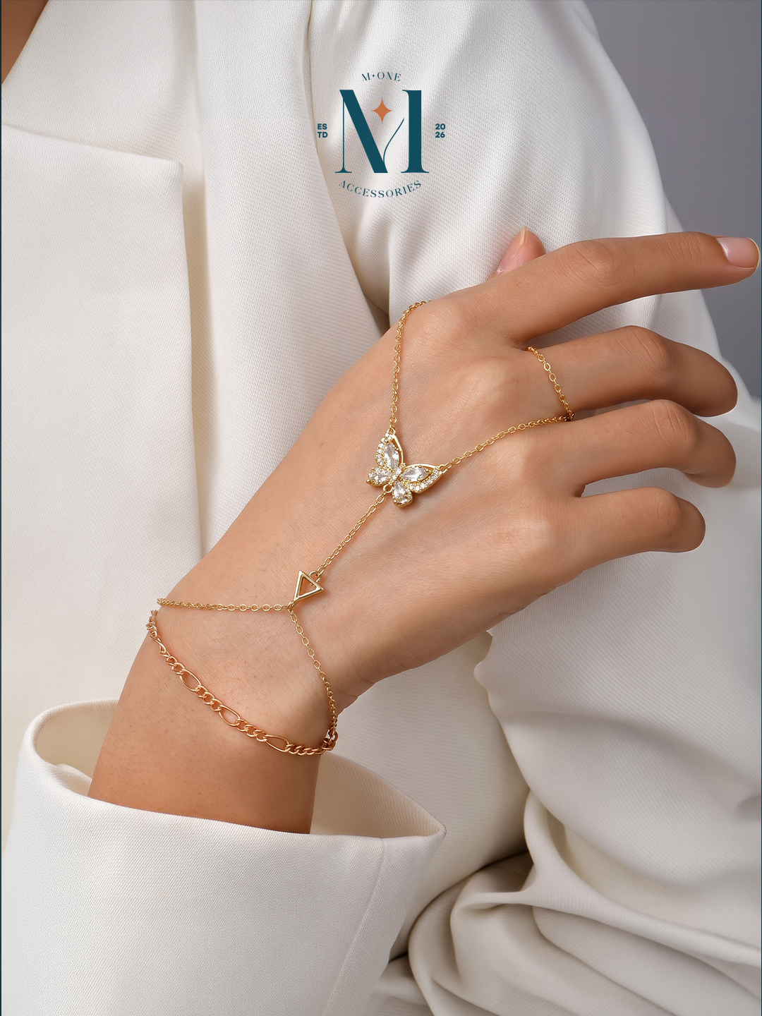 Gold-tone butterfly hand chain worn on the hand